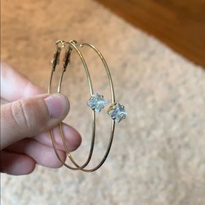 Gold hoops with white diamond shaped gem